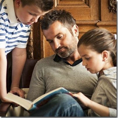 father reading to kids
